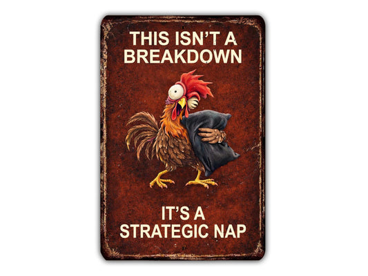 The image is a humorous sign with a rooster holding a pillow and the text "This isn't a breakdown, it's a strategic nap".
