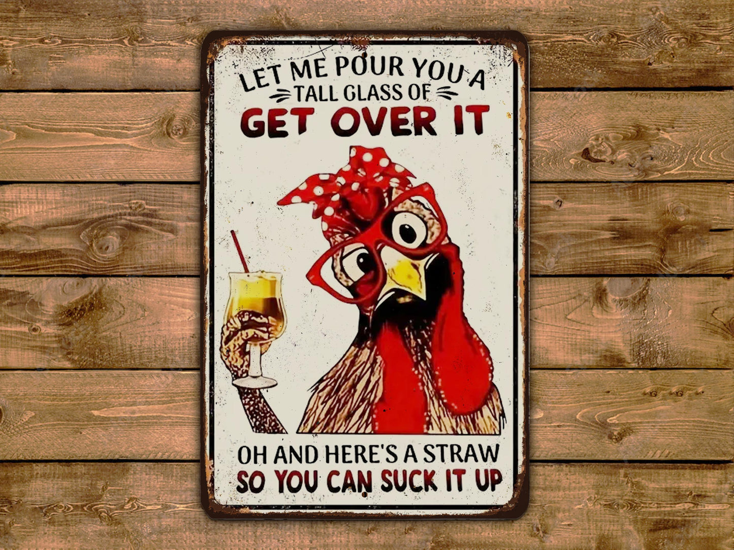 a metal sign with a rooster holding a drink