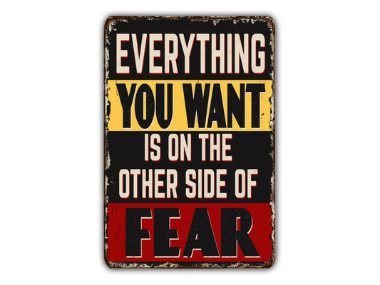 a sign that says everything you want is on the other side of fear