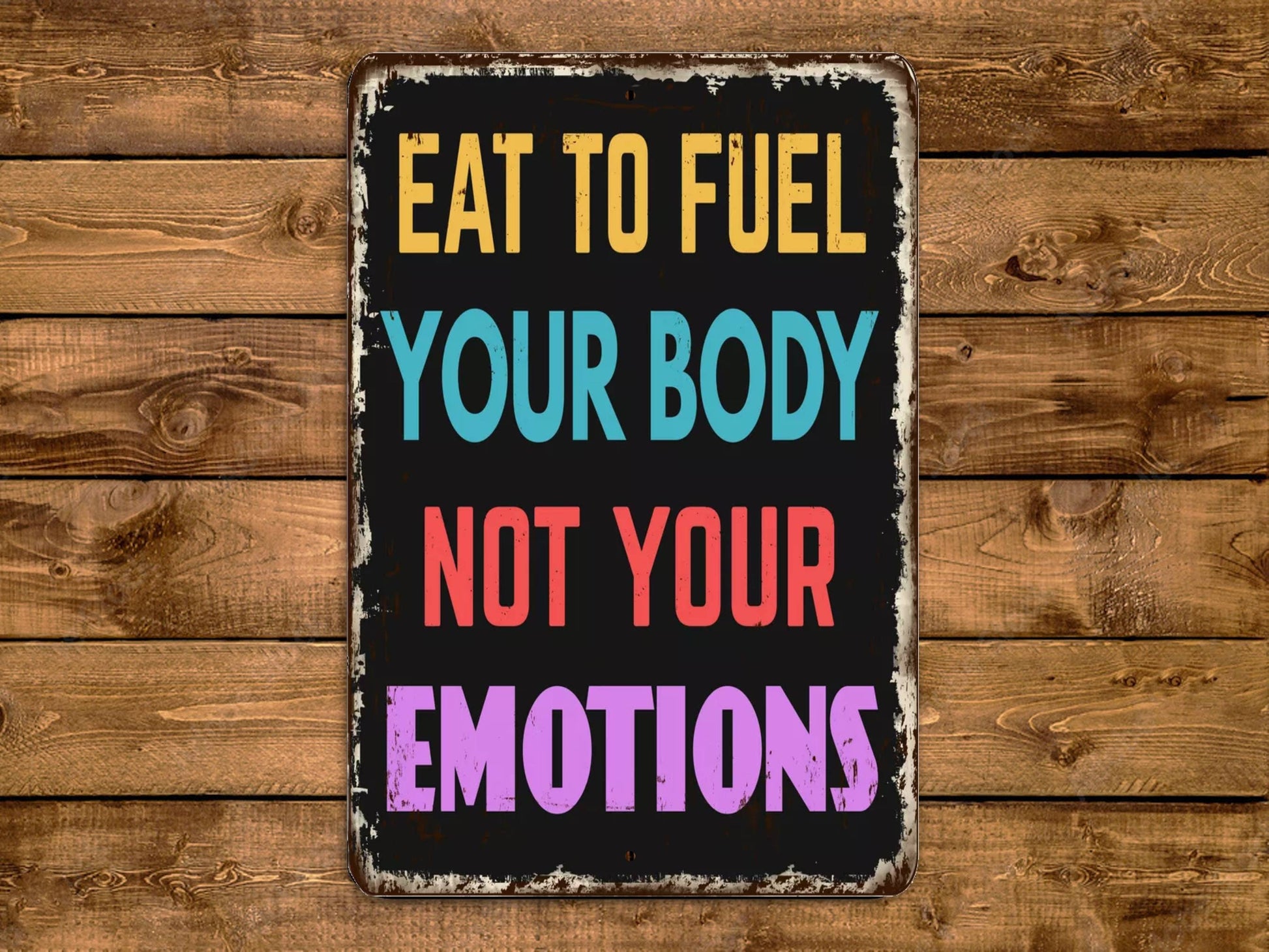 a sign that says eat to fuel your body not your emotions