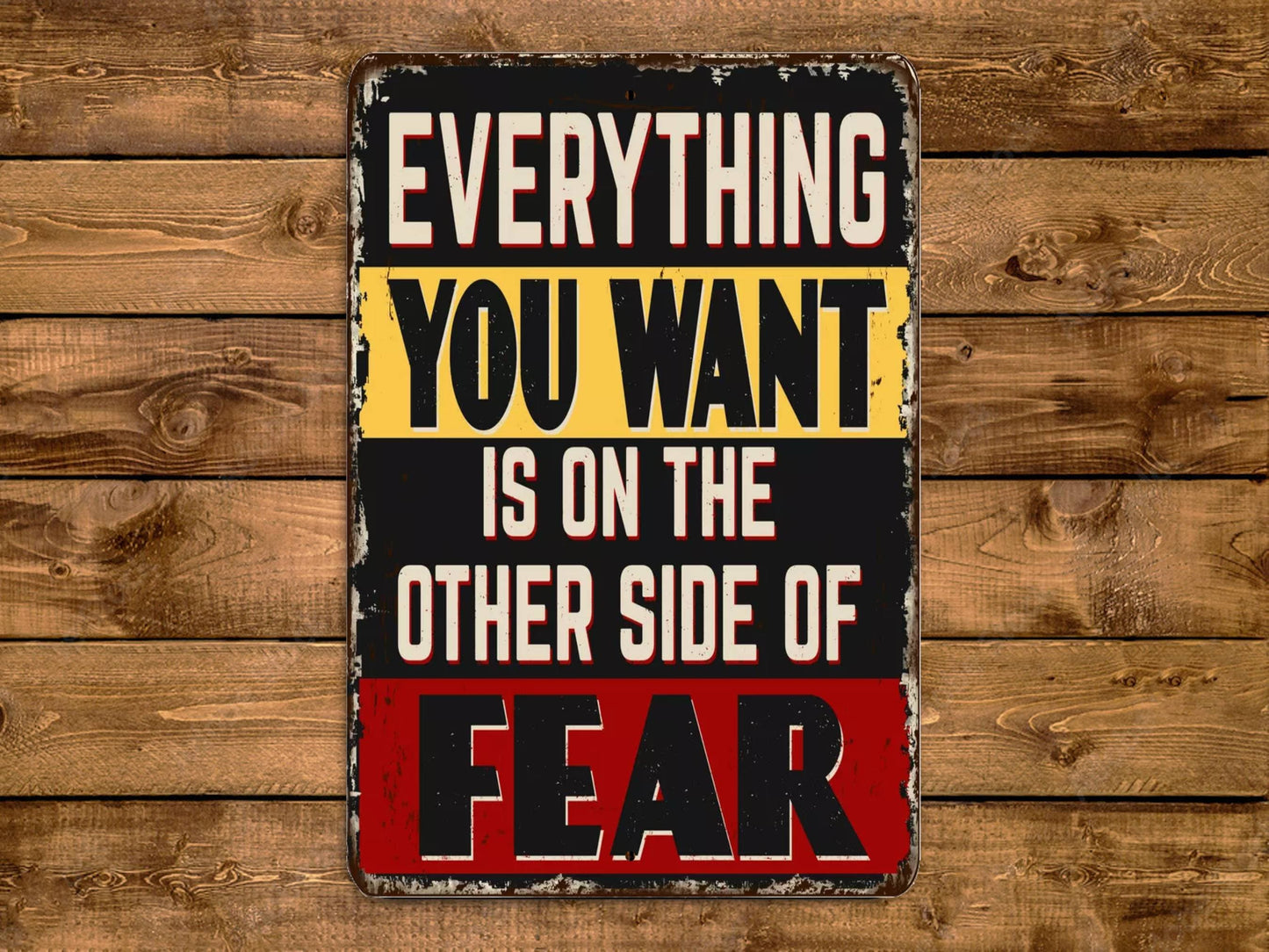 a sign that says everything you want is on the other side of fear