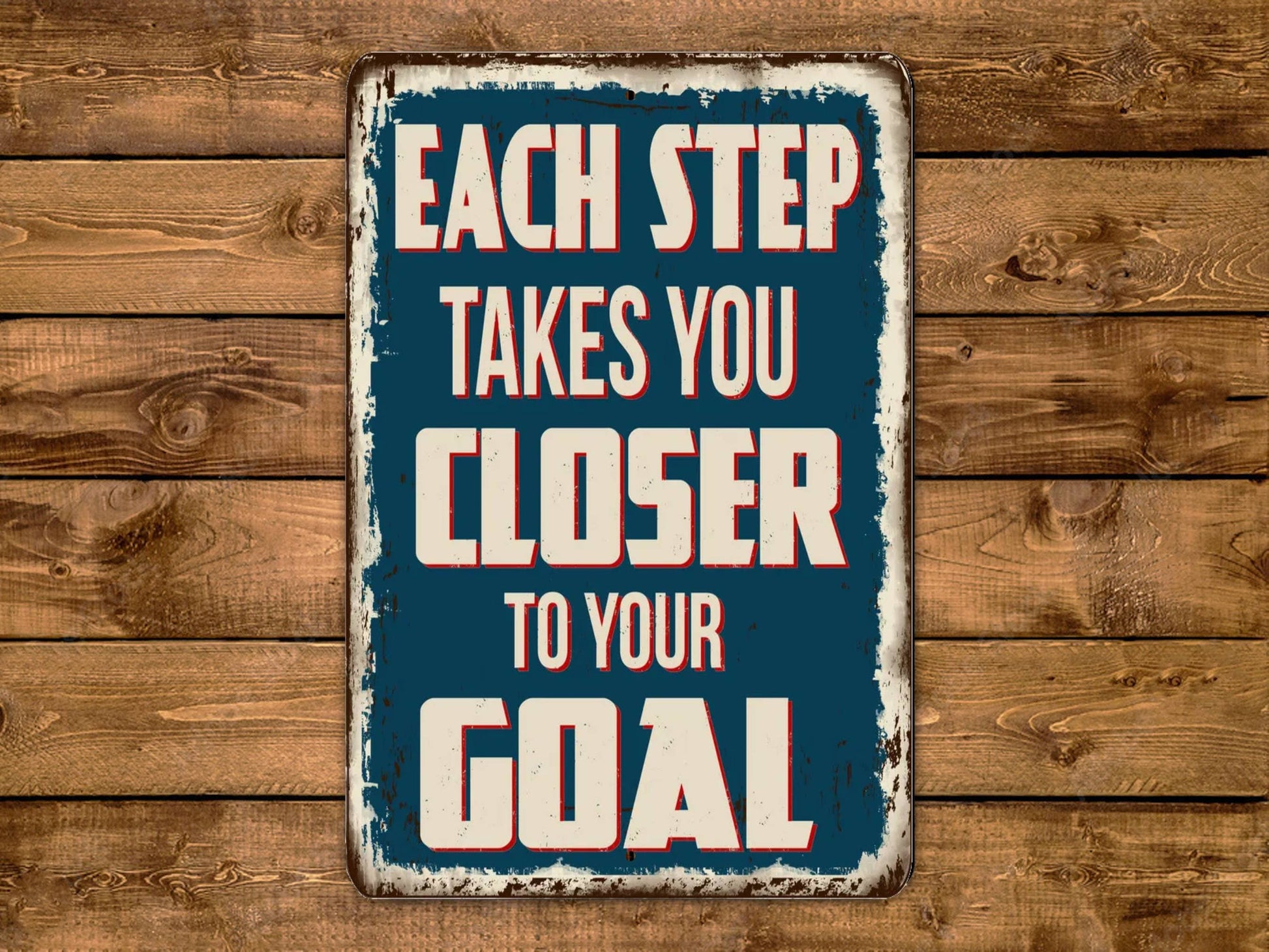 a sign that says each step takes you closer to your goal