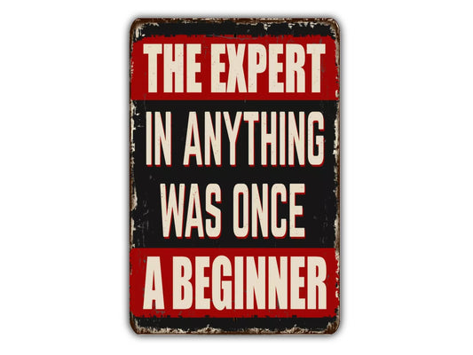 a sign that says the expert in anything was once a beginner