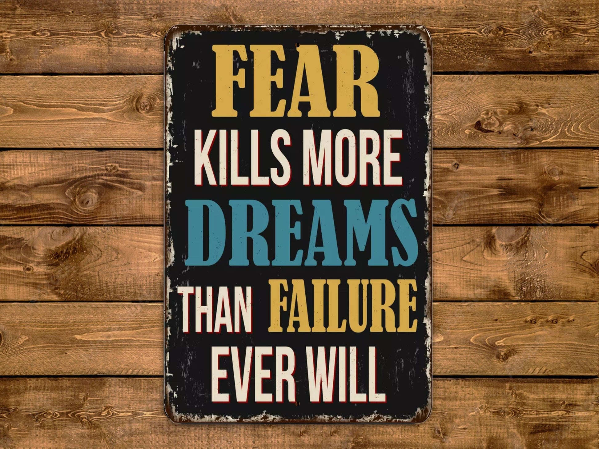 a sign that says fear kills more dreams than failure ever will