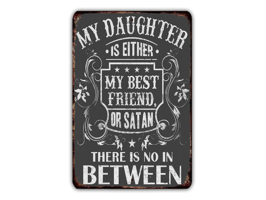 a metal sign that says, my daughter is either my best friend or satan there