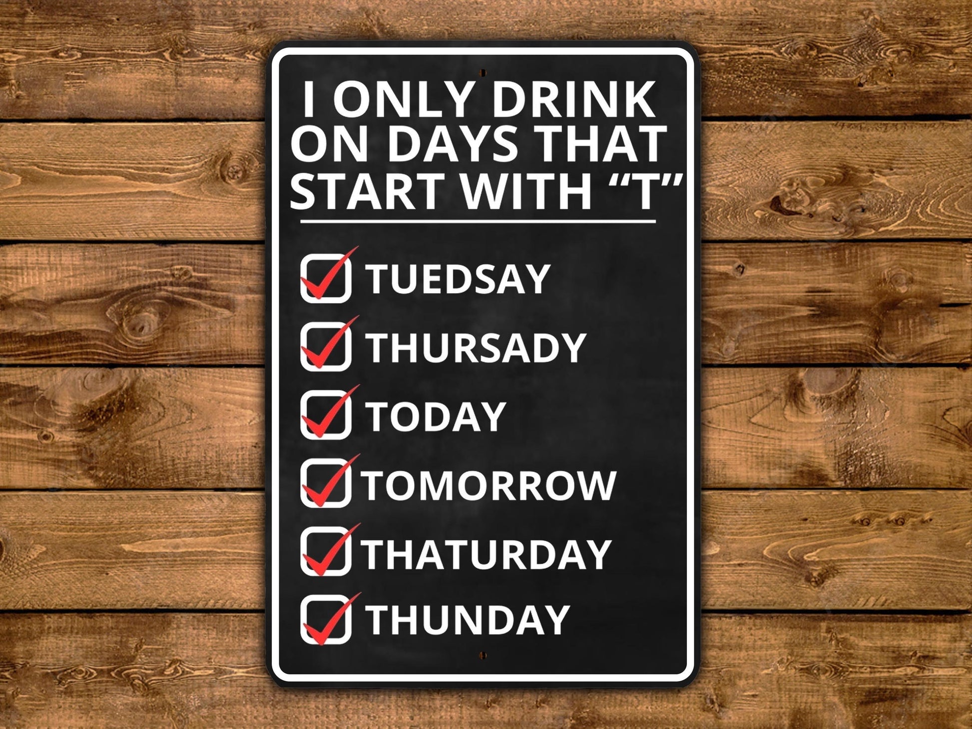 a sign on a wooden wall that says i only drink on days that start with