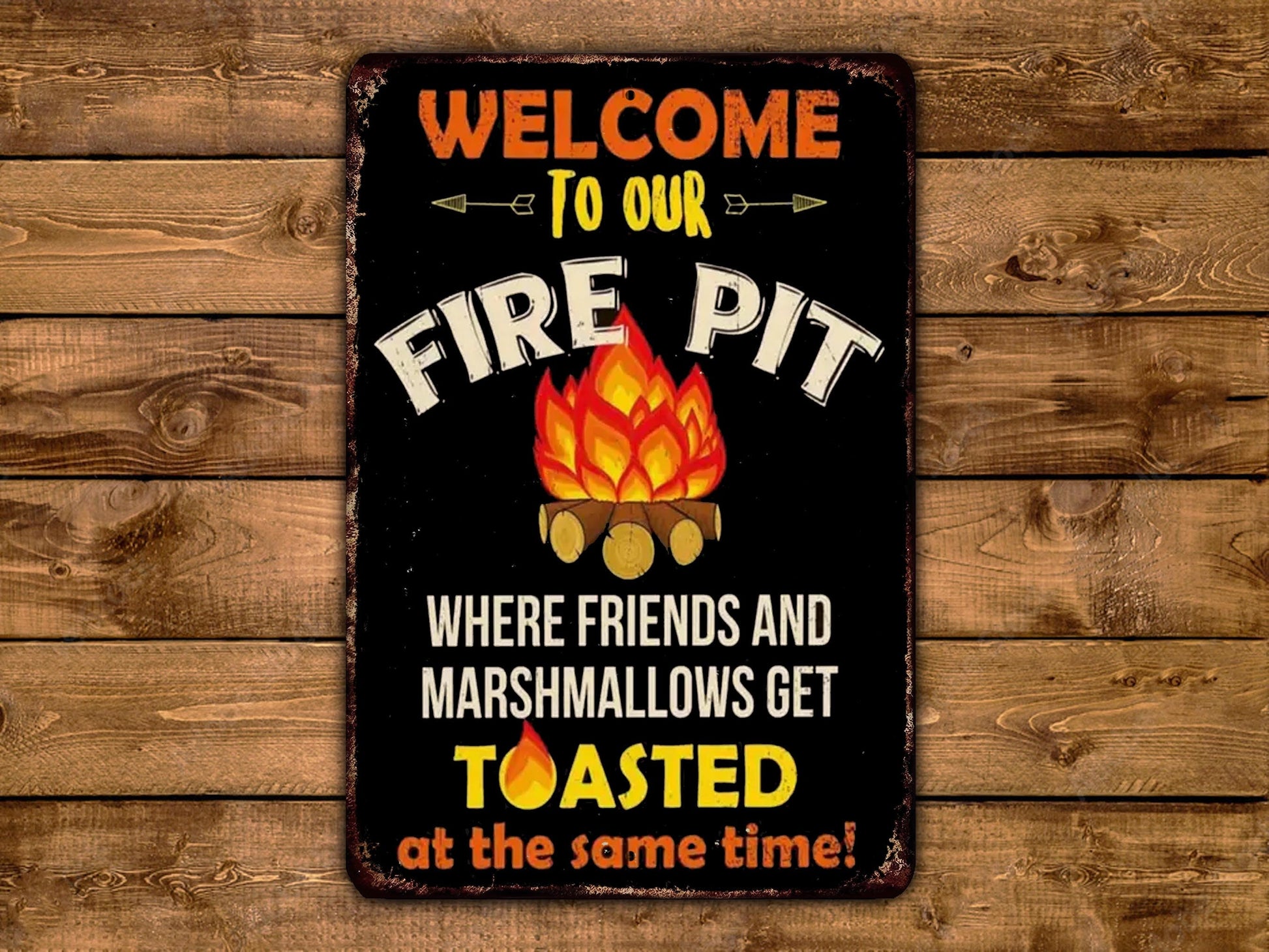 a sign that says welcome to our fire pit where friends and marshmallows