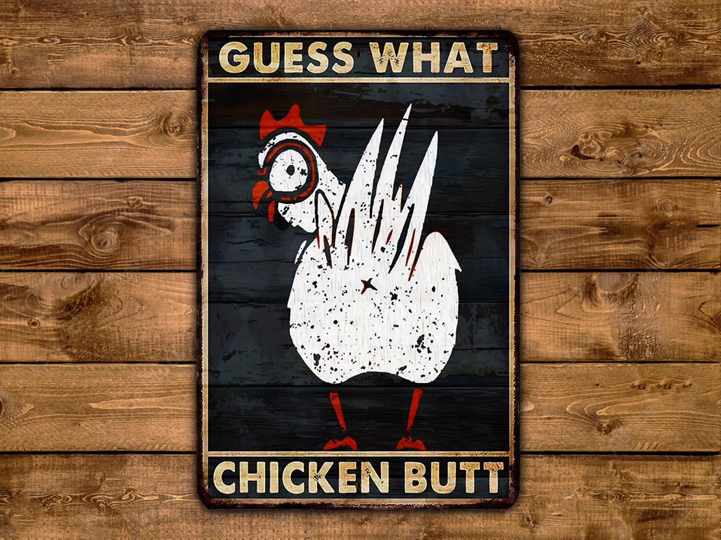 a sign on a wooden wall that says guess what chicken butt